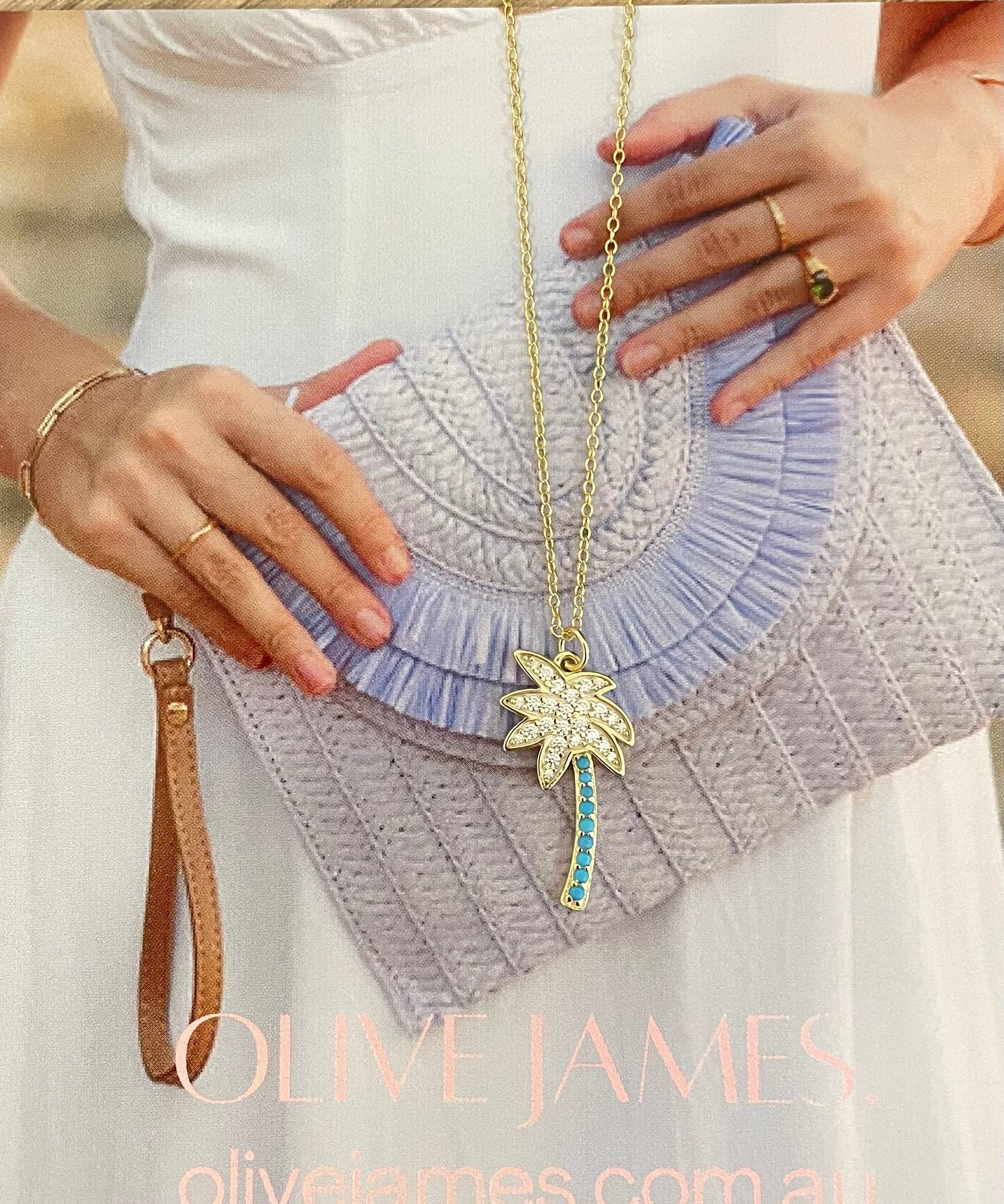 Olive James.  Palm Royale