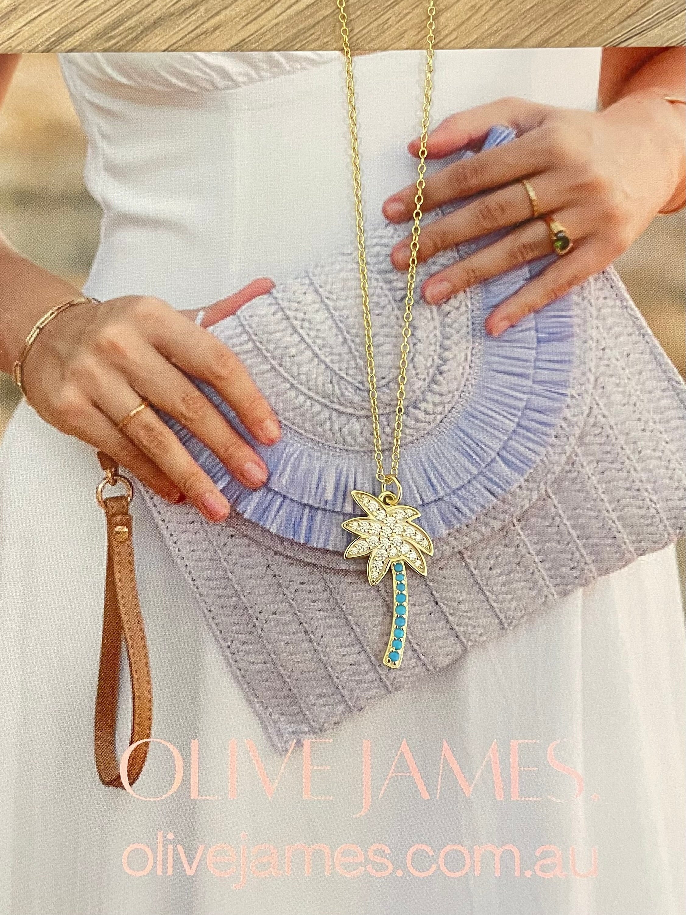 Olive James.  Palm Royale